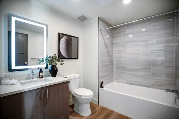 a bathroom with a toilet sink and bathtub