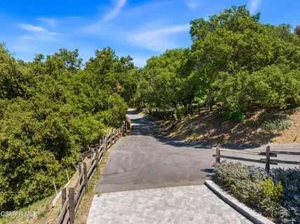 a swimming pool with outdoor seating and yard
