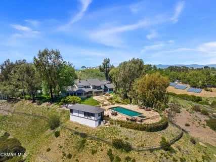 a view of swimming pool with a patio