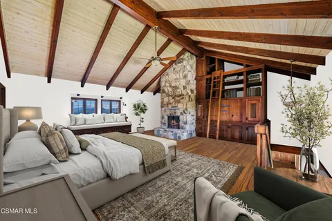 a kitchen with stainless steel appliances kitchen island granite countertop a table chairs stove and refrigerator