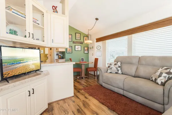 a living room with furniture and a large window
