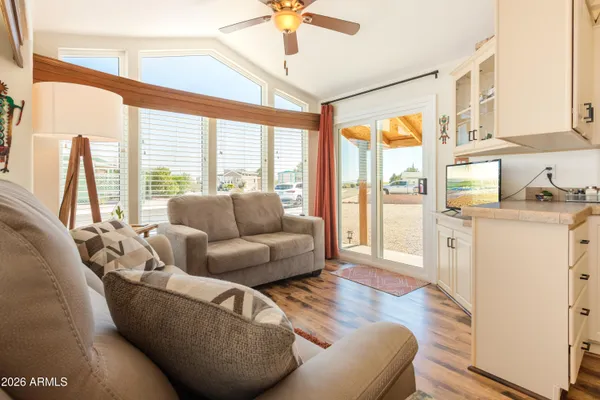 a living room with furniture and a large window