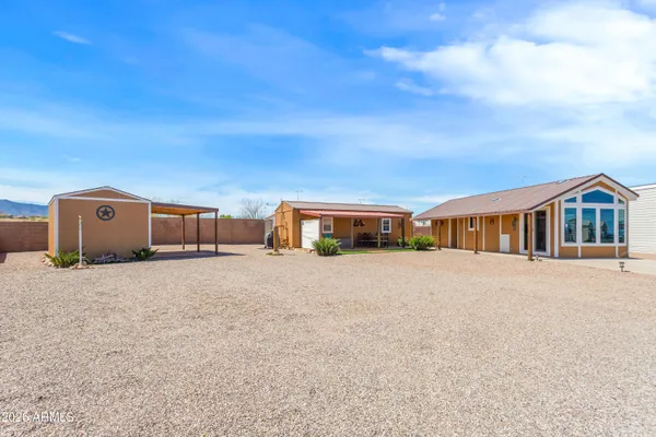 a kitchen with cabinets a refrigerator and a sink