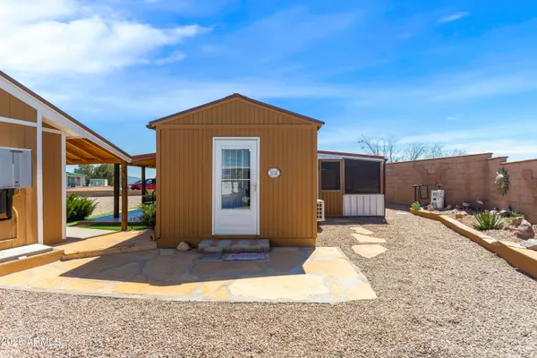 a view of sitting area in balcony with wooden floor