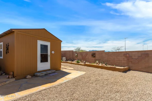 a view of a patio with table and chairs floor to ceiling window with wooden floor
