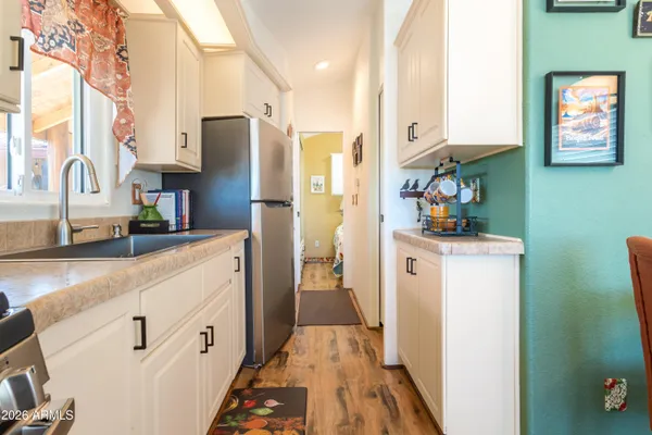 a kitchen with stainless steel appliances a refrigerator stove and microwave