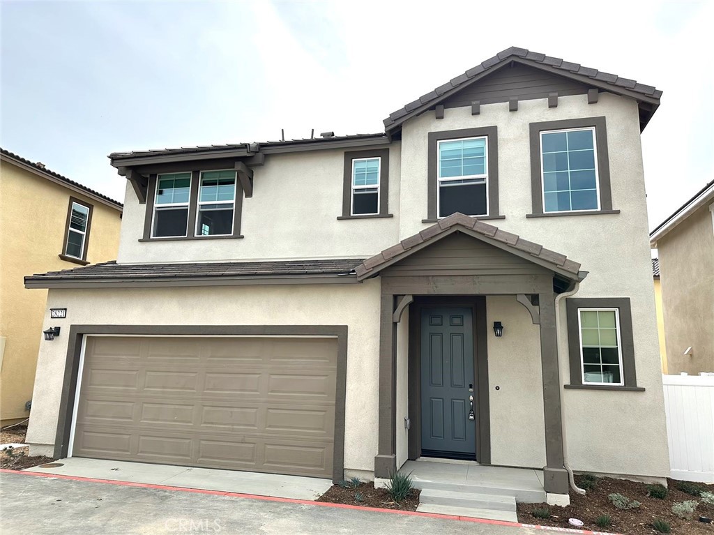 28221 Ashtree Street Temecula, CA 92591 - Photo 1 of 21 a front view of a house with a garage