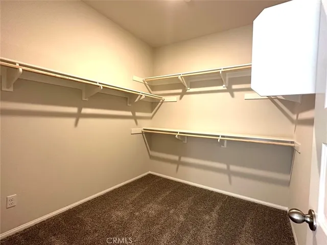 a view of an empty walk in closet
