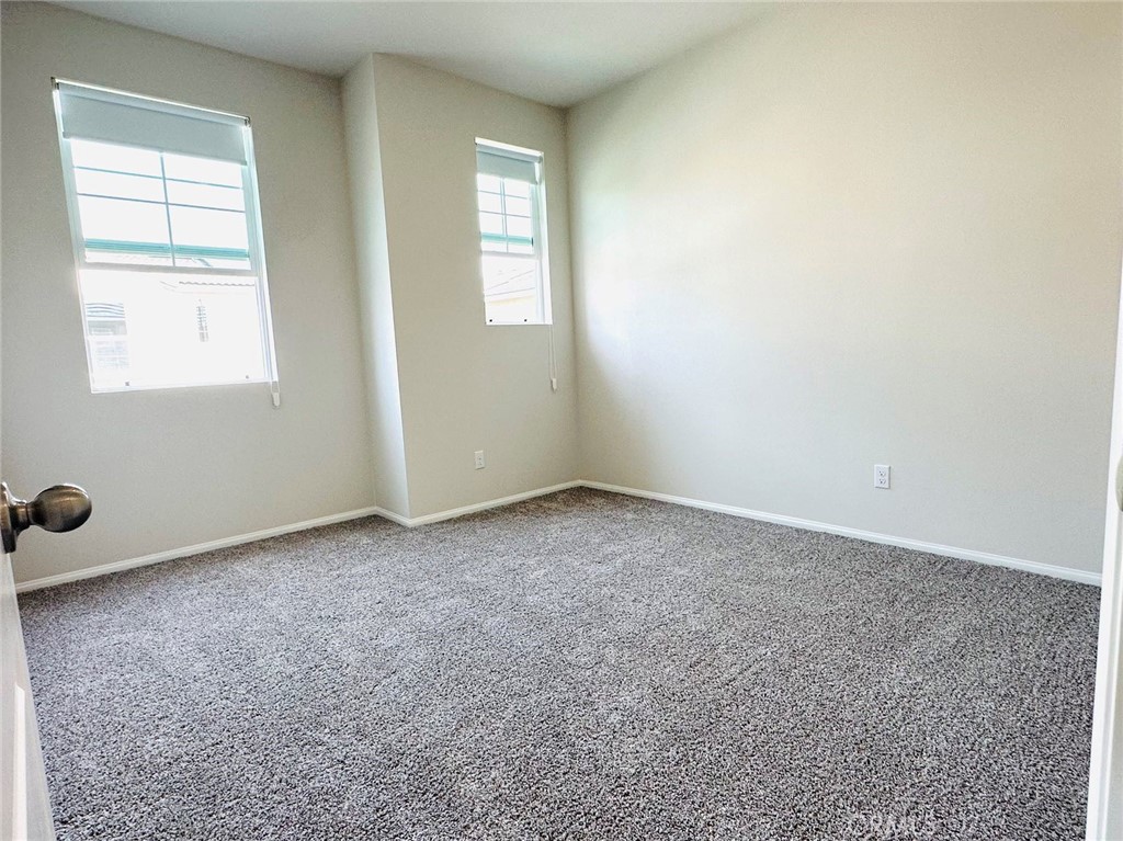28221 Ashtree Street Temecula, CA 92591 - Photo 16 of 21 an empty room with windows