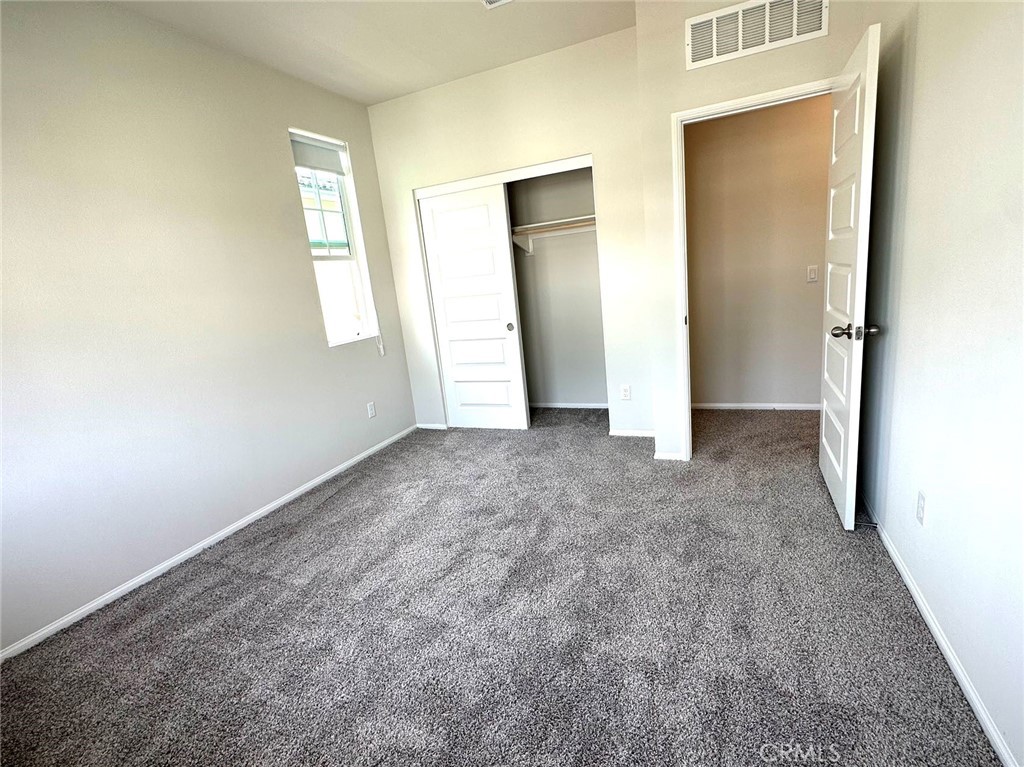 28221 Ashtree Street Temecula, CA 92591 - Photo 17 of 21 an empty room with windows