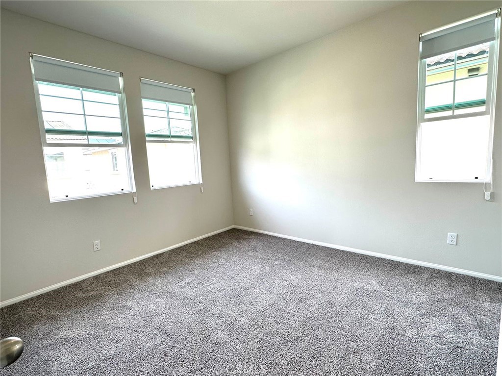28221 Ashtree Street Temecula, CA 92591 - Photo 18 of 21 an empty room with windows