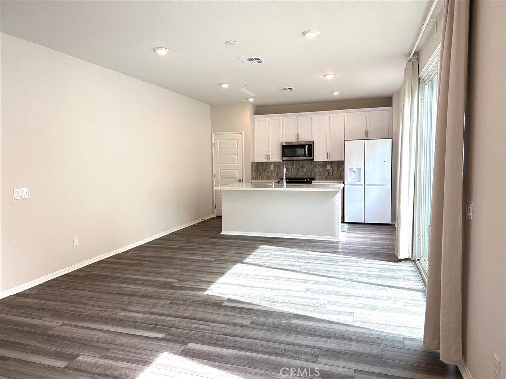 28221 Ashtree Street Temecula, CA 92591 - Photo 2 of 21 a view of kitchen with wooden floor