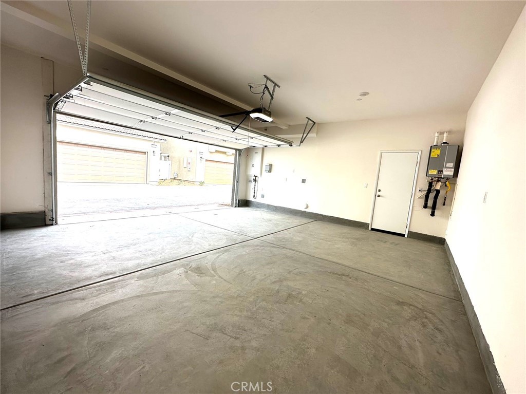 28221 Ashtree Street Temecula, CA 92591 - Photo 21 of 21 a view of an empty room with a kitchen