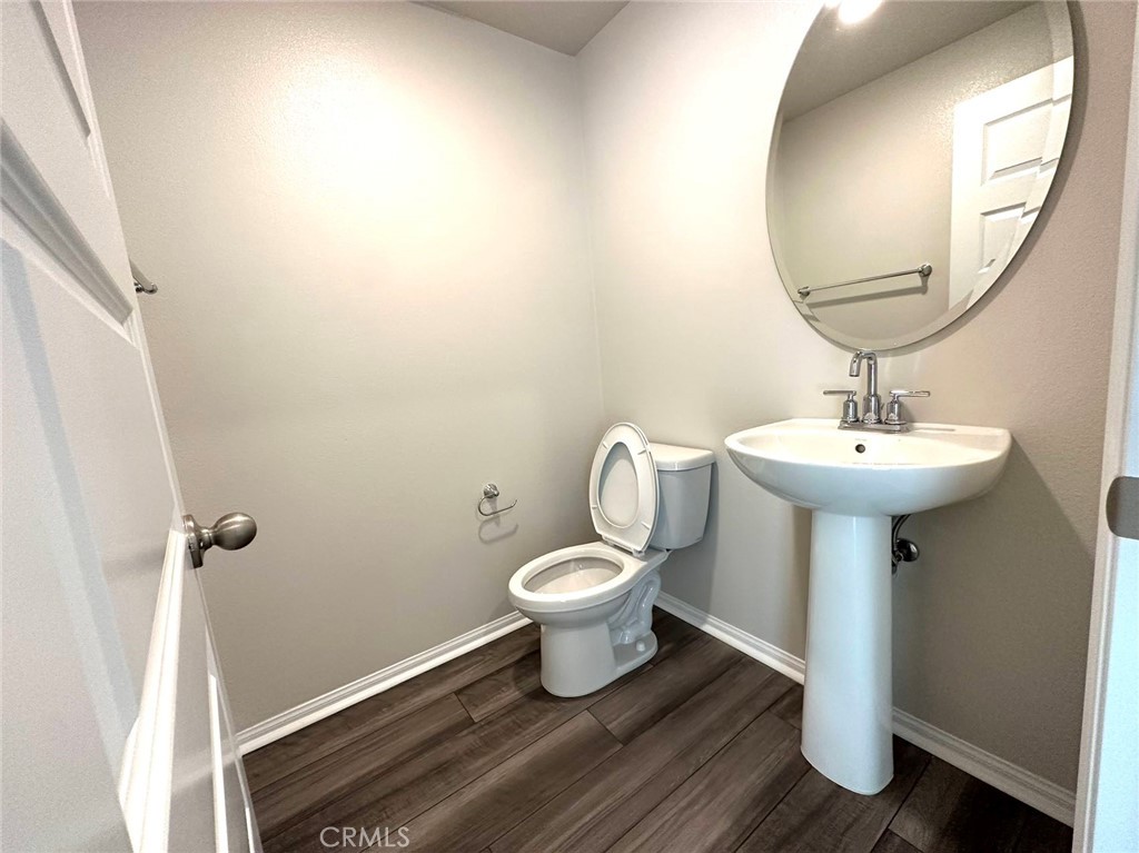 28221 Ashtree Street Temecula, CA 92591 - Photo 8 of 21 a bathroom with a sink toilet and a mirror