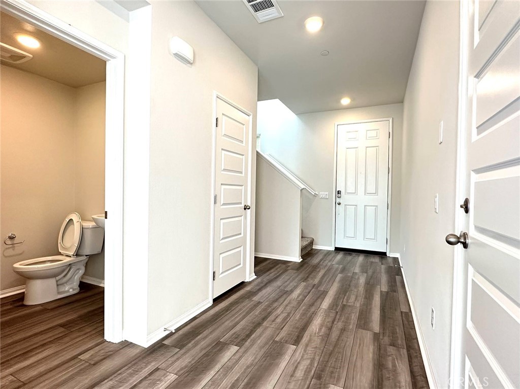 28221 Ashtree Street Temecula, CA 92591 - Photo 9 of 21 a bathroom with a toilet and a shower