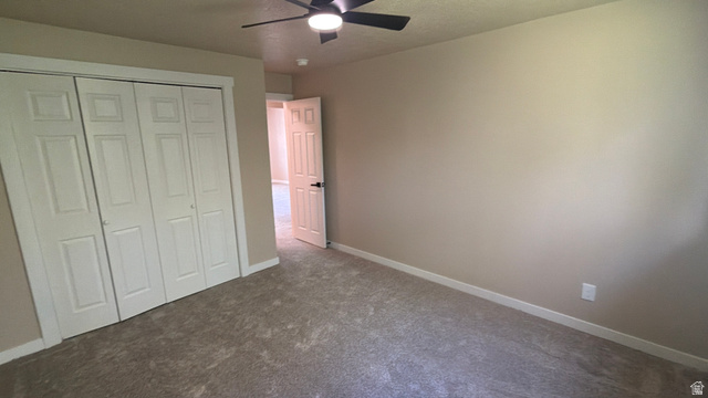 647 Swenson Avenue, Unit 4 Springville, UT 84663 - Photo 12 of 14 Bed 2. Unfurnished bedroom featuring carpet, ceiling fan, and a closet