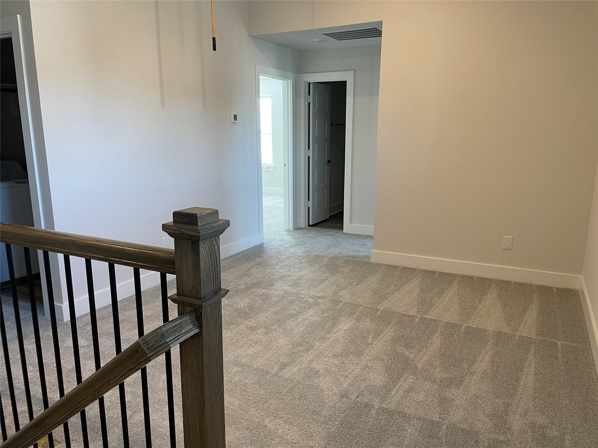 10638 Whitejacket Conroe, TX 77385 - Photo 4 of 25 a view of a hallway with wooden floor