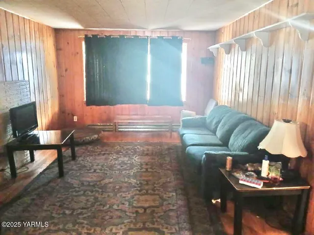 a living room with furniture and a window