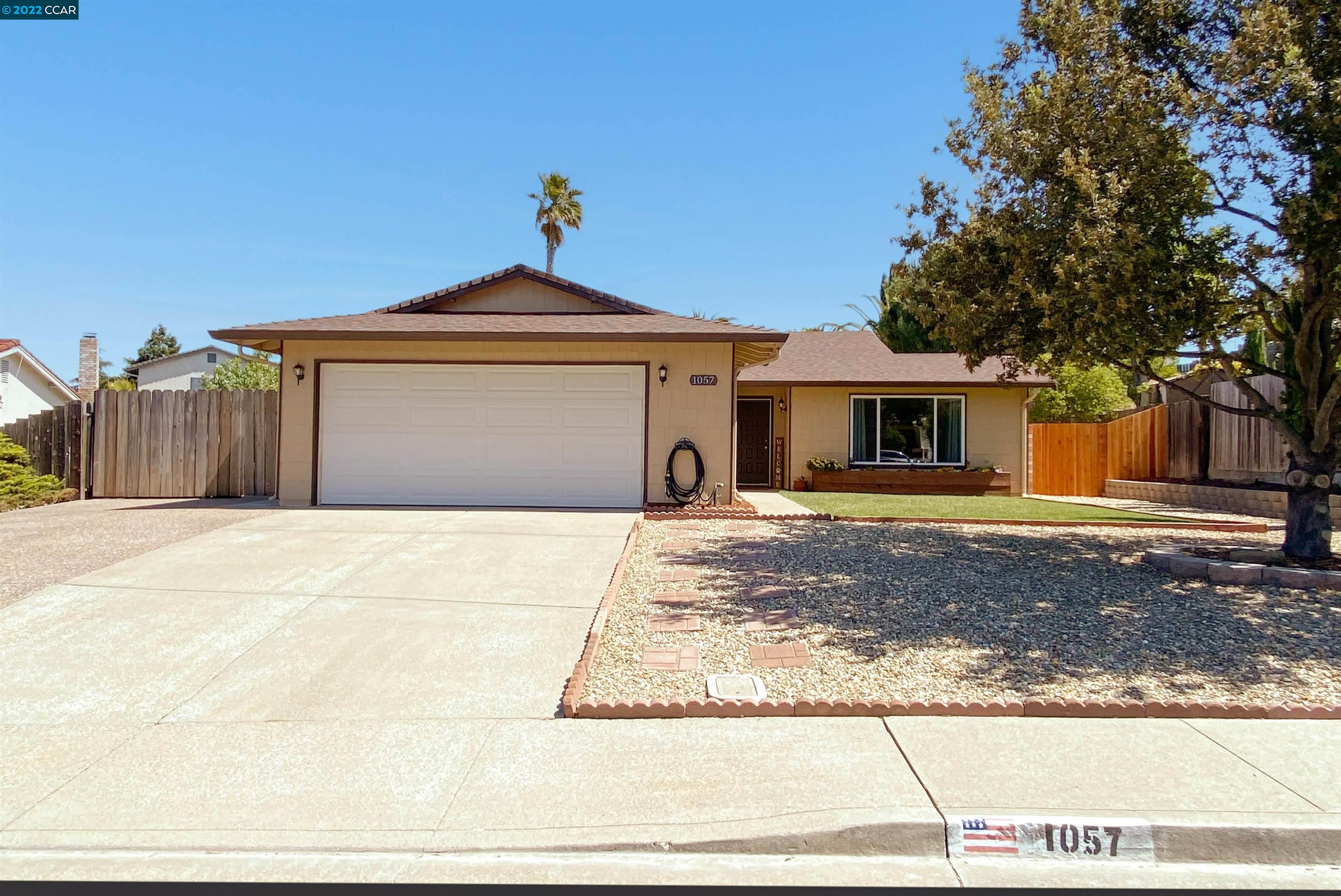 1057 Seascape Circle Rodeo, CA 94572 - Photo 1 of 1 a front view of a house with a yard