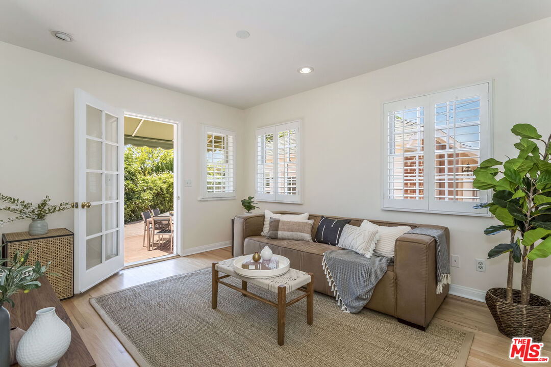 5967 Carpenter Avenue Valley Village, CA 91601 - Photo 21 of 32 a living room with furniture and a large window