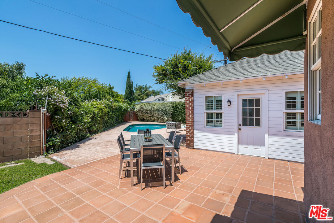 5967 Carpenter Avenue Valley Village, CA 91601 - Photo 23 of 32 a view of a patio with table and chairs and potted plants