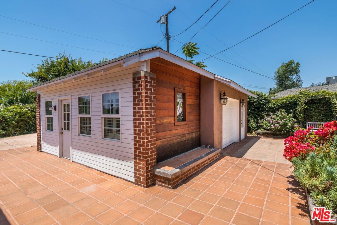 5967 Carpenter Avenue Valley Village, CA 91601 - Photo 24 of 32 a front view of a house with a garage
