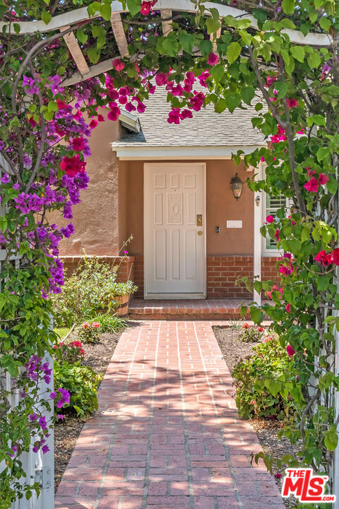 5967 Carpenter Avenue Valley Village, CA 91601 - Photo 3 of 32 a small garden covered with tall trees