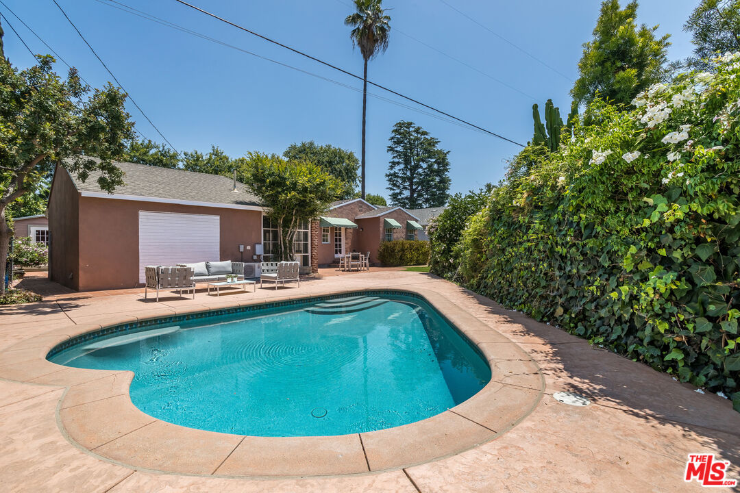5967 Carpenter Avenue Valley Village, CA 91601 - Photo 31 of 32 a view of a swimming pool with a yard