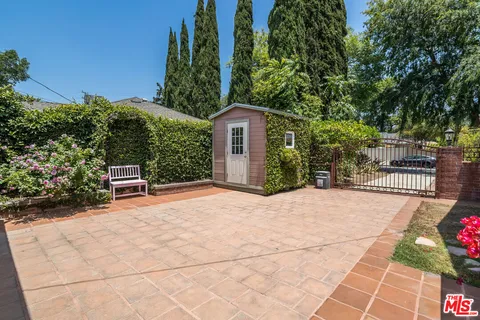 a house with trees in the background