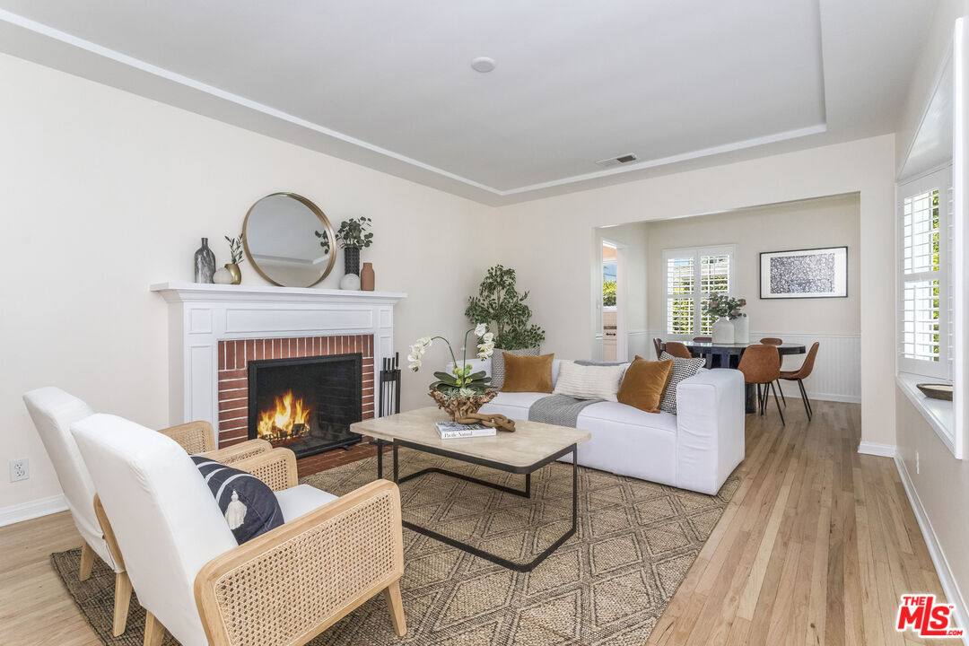 5967 Carpenter Avenue Valley Village, CA 91601 - Photo 6 of 32 a living room with furniture and a fireplace