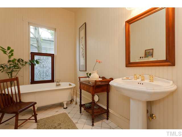 115 North Bloodworth Street Raleigh, NC 27601 - Photo 11 of 25 Tile floors, a tip toe tub and tankless hot water add old house character in a new home.