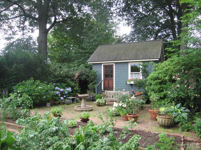 115 North Bloodworth Street Raleigh, NC 27601 - Photo 15 of 25 The 15x11 ft cottage overlooks a cutting garden and vegetable beds.