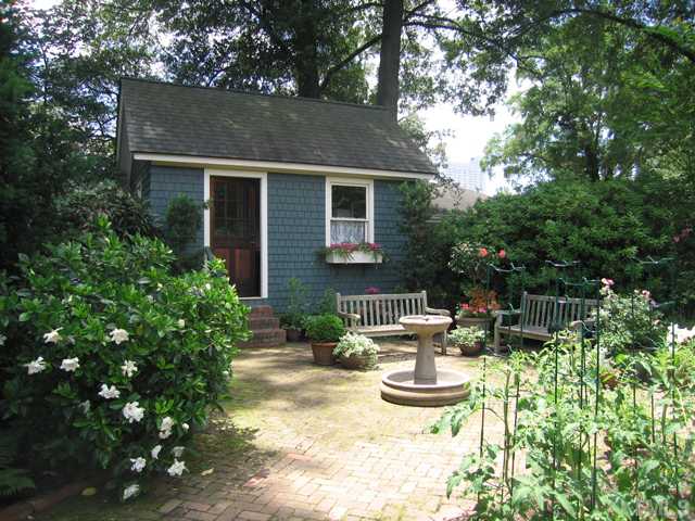115 North Bloodworth Street Raleigh, NC 27601 - Photo 3 of 25 On added land in back they built a hide-away cottage and patio where they relax and grow vegetables.