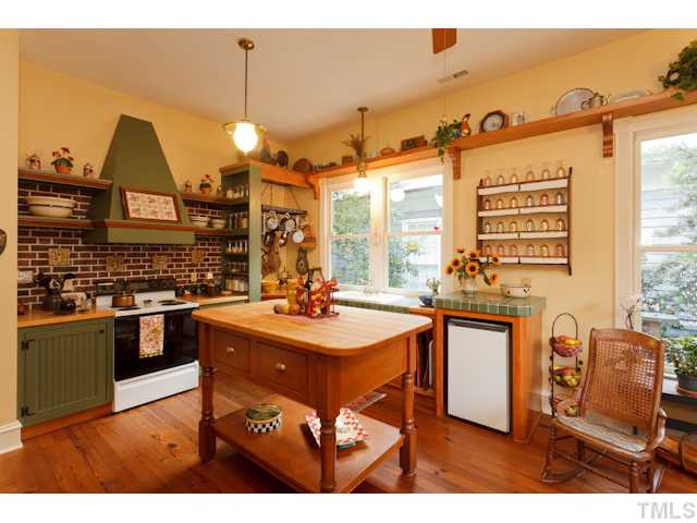 115 North Bloodworth Street Raleigh, NC 27601 - Photo 5 of 25 A local craftsman built the cabinets and table., which conveys with the house.