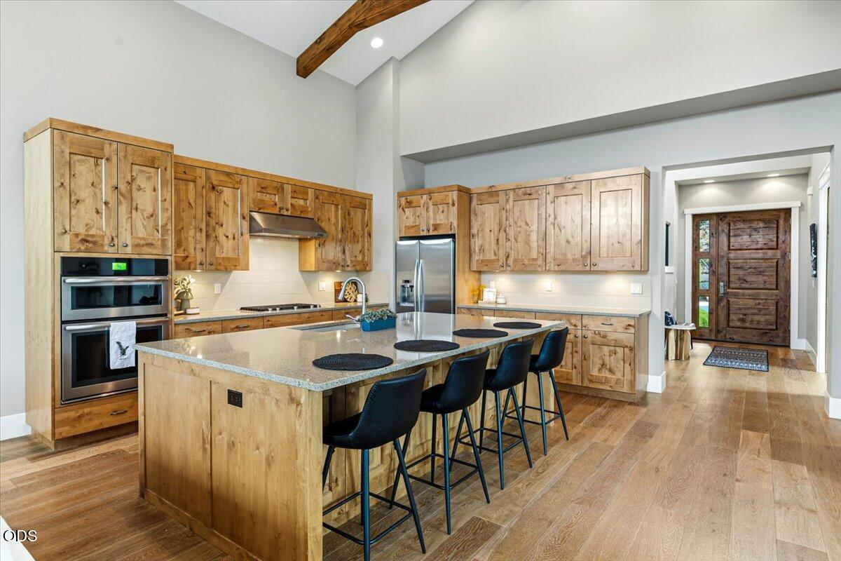 61333 Kindle Rock Loop Bend, OR 97702 - Photo 19 of 53 a kitchen with stainless steel appliances granite countertop a stove and a refrigerator