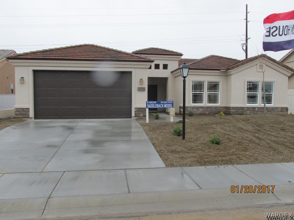 4276 East Cane Ranch Road Kingman, AZ 86401 - Photo 1 of 23 a front view of a house with garden