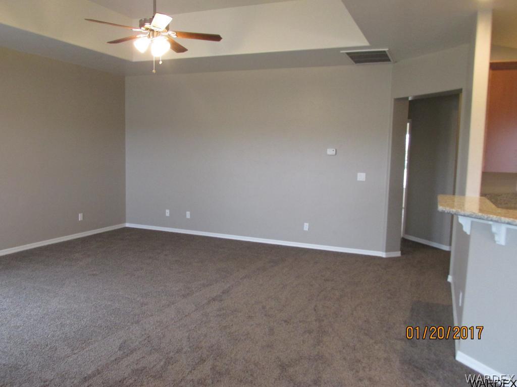 4276 East Cane Ranch Road Kingman, AZ 86401 - Photo 11 of 23 an empty room with a fan & a window