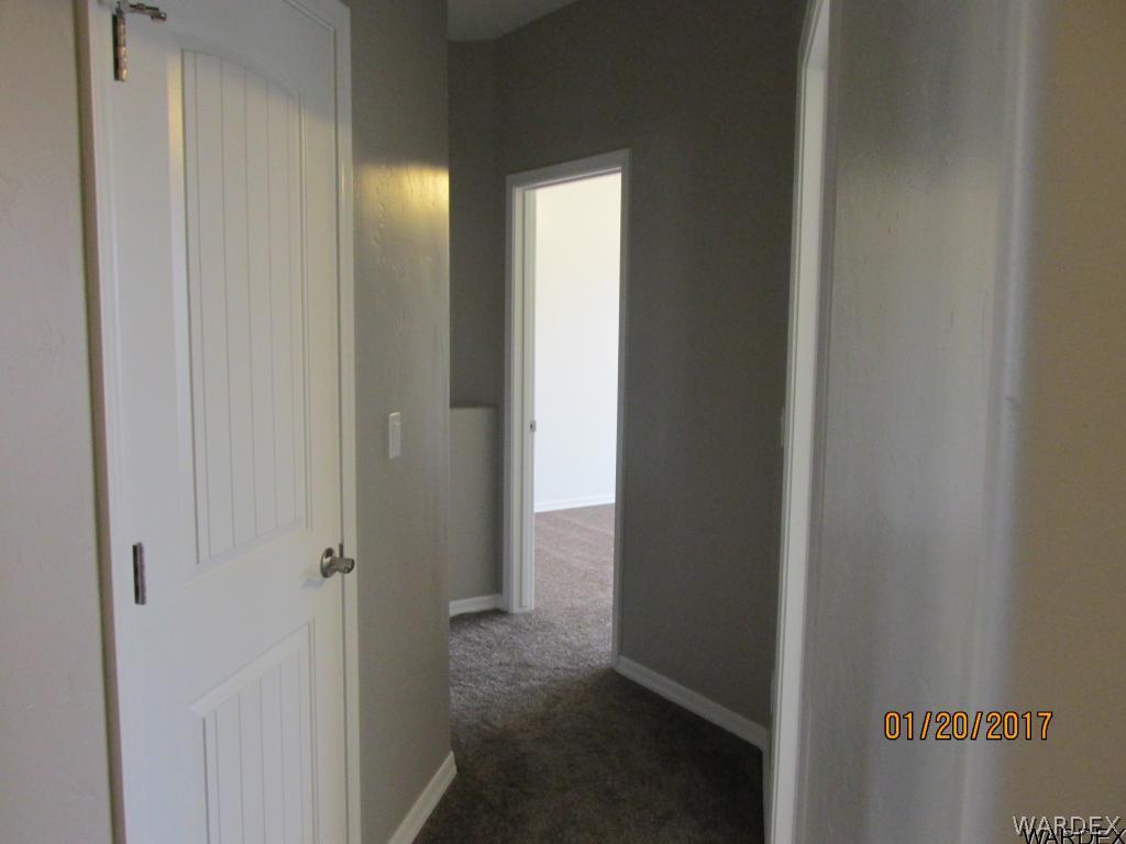 4276 East Cane Ranch Road Kingman, AZ 86401 - Photo 14 of 23 a view of hallway with a bathroom