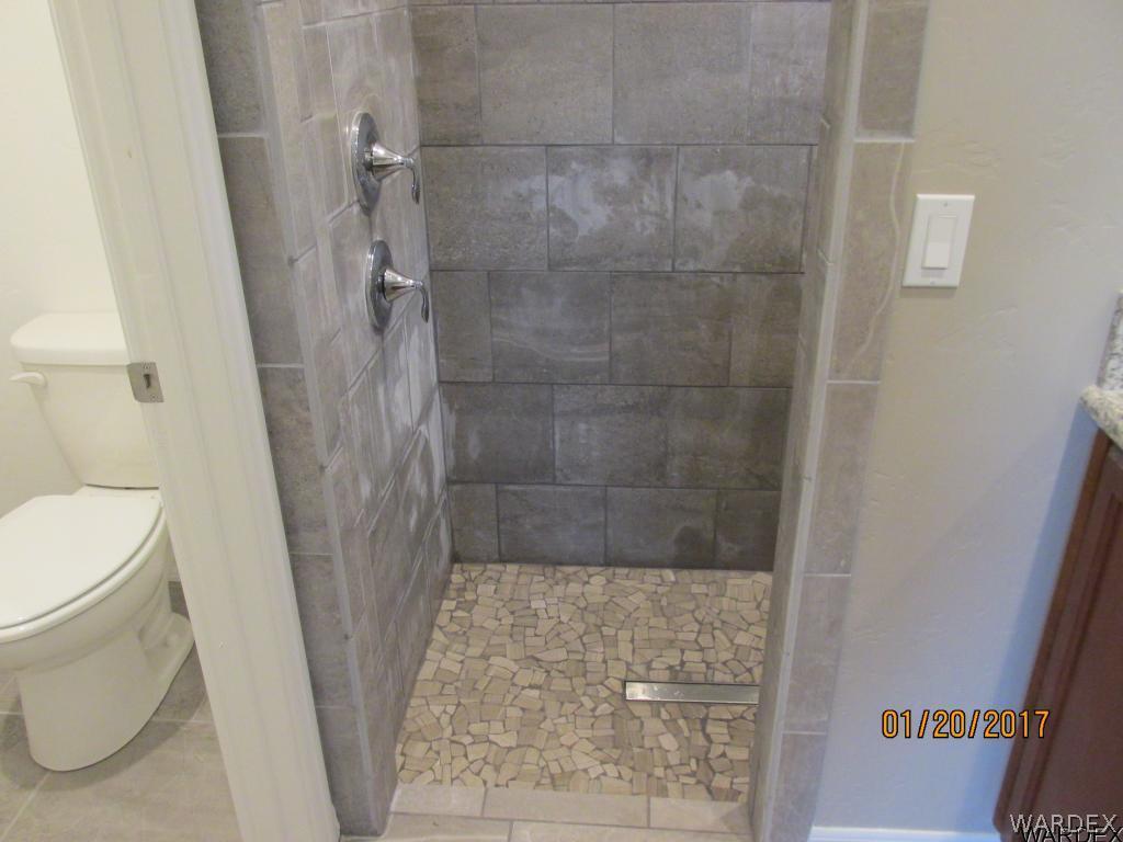 4276 East Cane Ranch Road Kingman, AZ 86401 - Photo 5 of 23 a bathroom with a shower and a toilet
