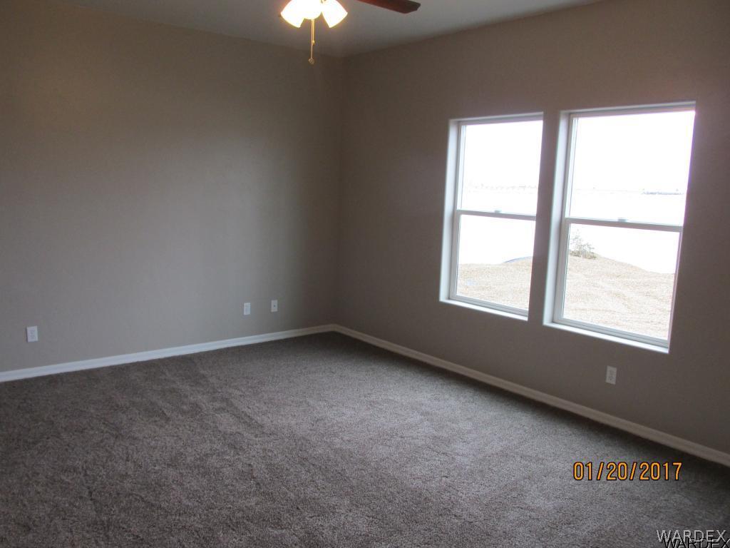 4276 East Cane Ranch Road Kingman, AZ 86401 - Photo 9 of 23 an empty room with a window