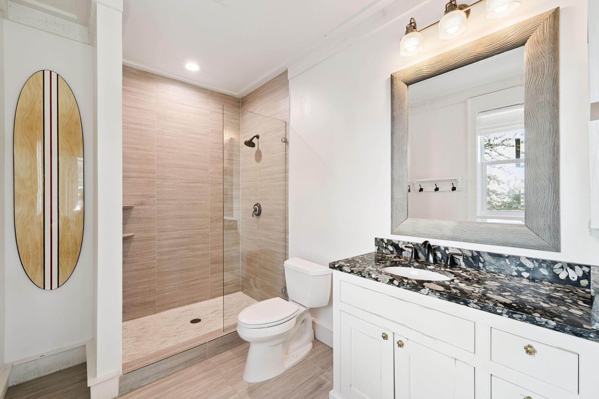 425 Beachfront Trail Santa Rosa Beach, FL 32459 - Photo 20 of 117 a bathroom with a granite countertop sink a toilet and shower