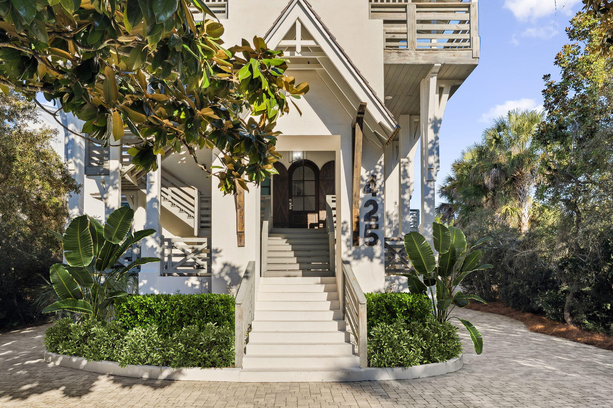 425 Beachfront Trail Santa Rosa Beach, FL 32459 - Photo 2 of 117 a front view of a house with a tree