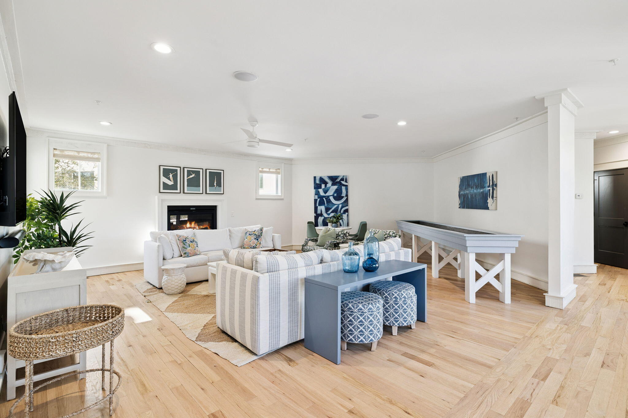 425 Beachfront Trail Santa Rosa Beach, FL 32459 - Photo 29 of 117 a living room with fireplace furniture and a wooden floor
