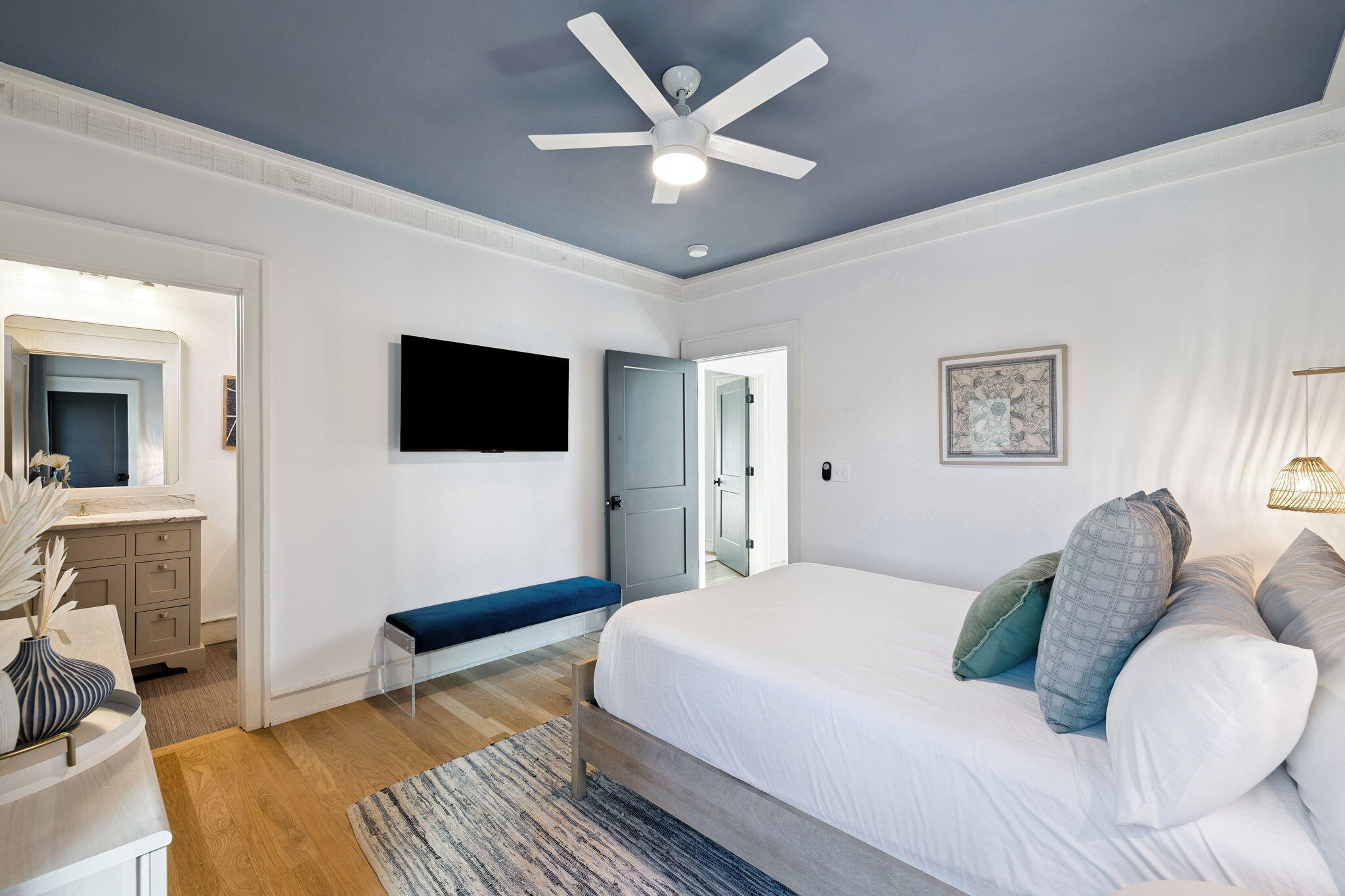 425 Beachfront Trail Santa Rosa Beach, FL 32459 - Photo 35 of 117 a living room with a bed furniture and a flat screen tv