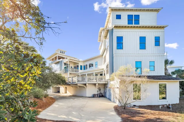 a spacious bedroom with a large bed and a large window