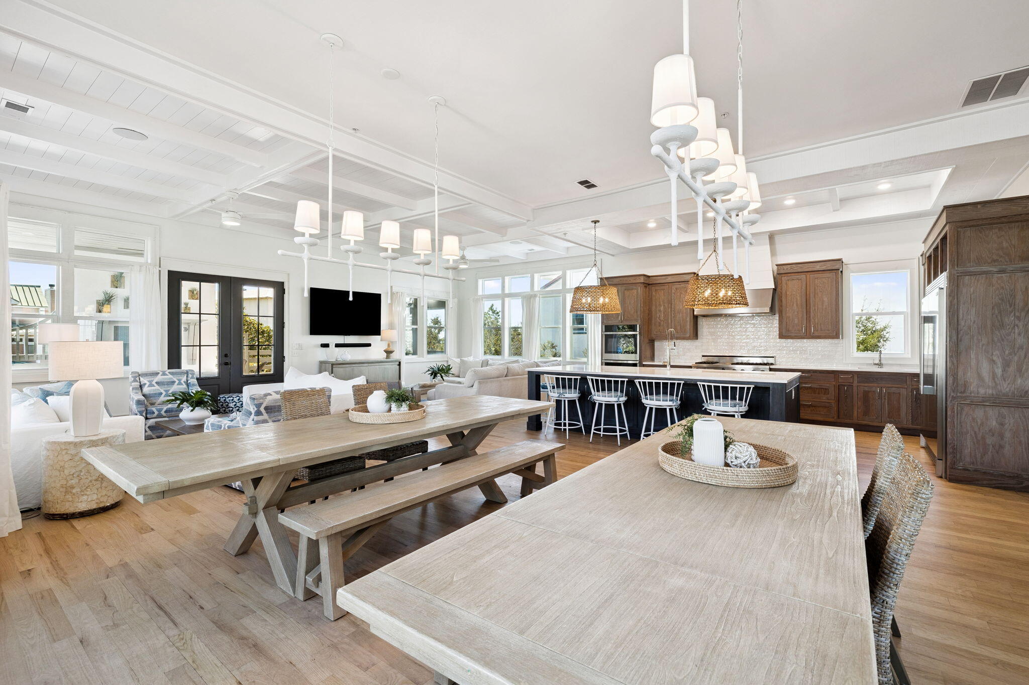 425 Beachfront Trail Santa Rosa Beach, FL 32459 - Photo 52 of 117 a view of a dining room with furniture a chandelier and wooden floor