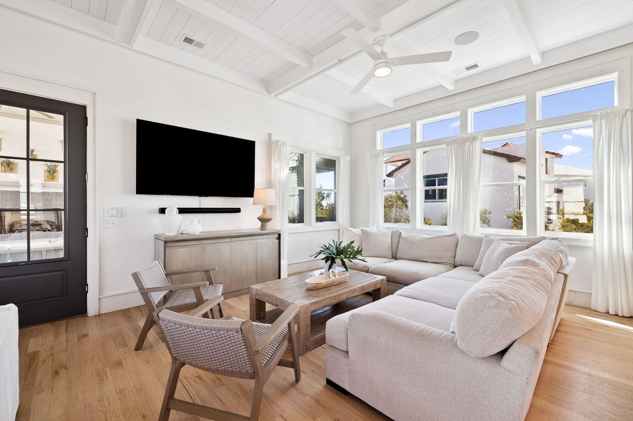 425 Beachfront Trail Santa Rosa Beach, FL 32459 - Photo 60 of 117 a living room with furniture and a flat screen tv