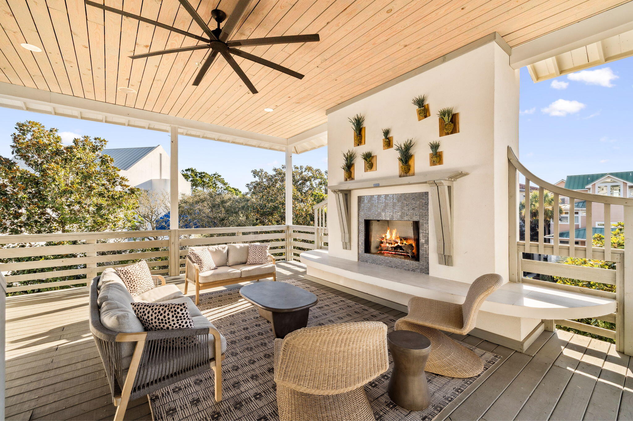 425 Beachfront Trail Santa Rosa Beach, FL 32459 - Photo 62 of 117 a living room with furniture a fireplace and a floor to ceiling window