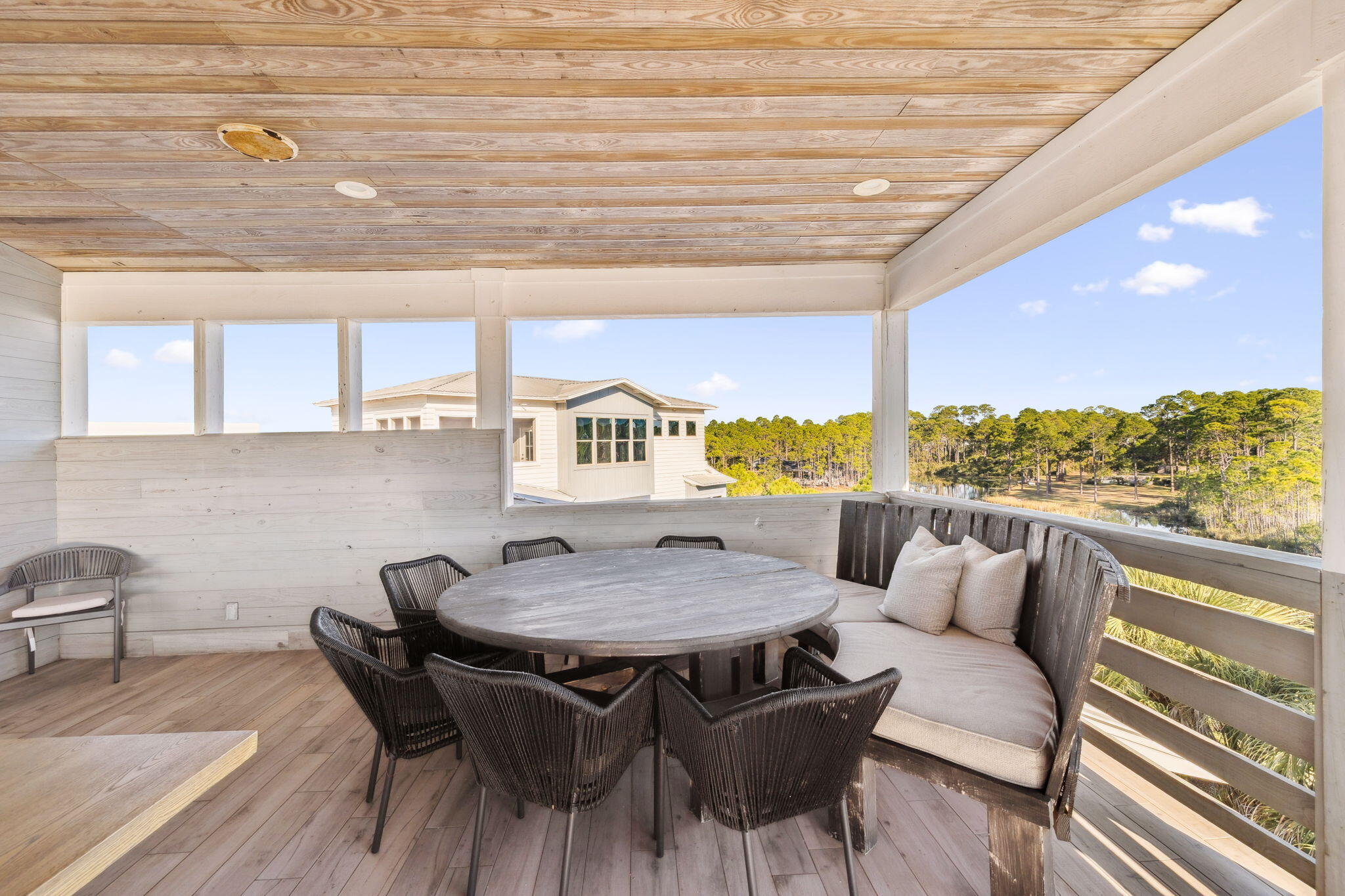 425 Beachfront Trail Santa Rosa Beach, FL 32459 - Photo 66 of 117 a view of a dining room with furniture and wooden floor