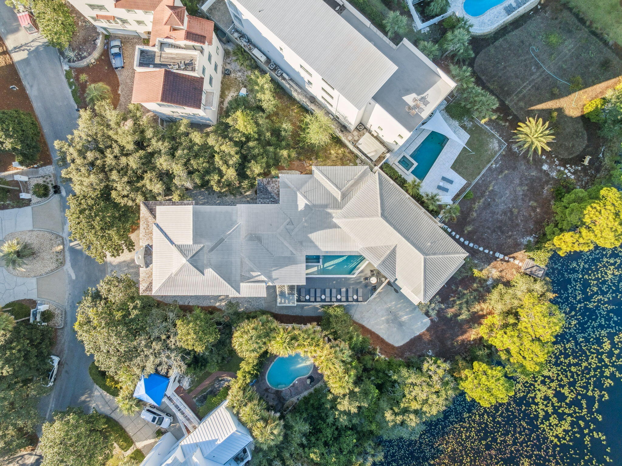 425 Beachfront Trail Santa Rosa Beach, FL 32459 - Photo 7 of 117 an aerial view of a house with a garden and swimming pool